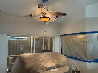 Plastic containment sealing off a room during a water damage dry-out