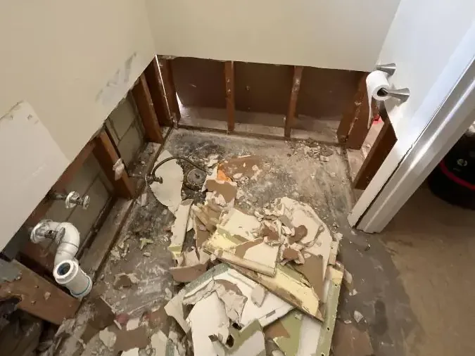 Bathroom opened to the studs after sewage cleanup