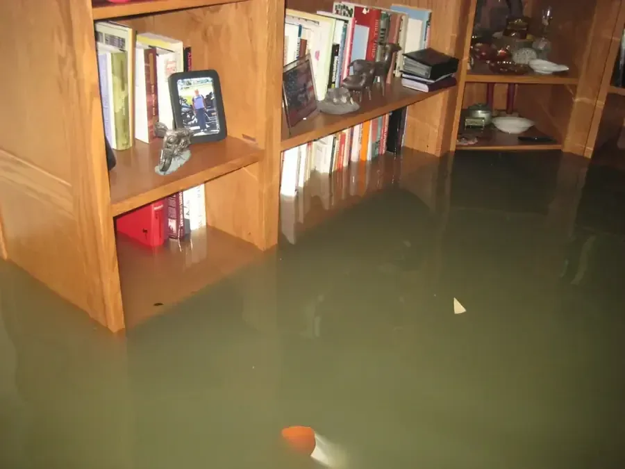 Storm floodwater damage being cleaned up inside a home